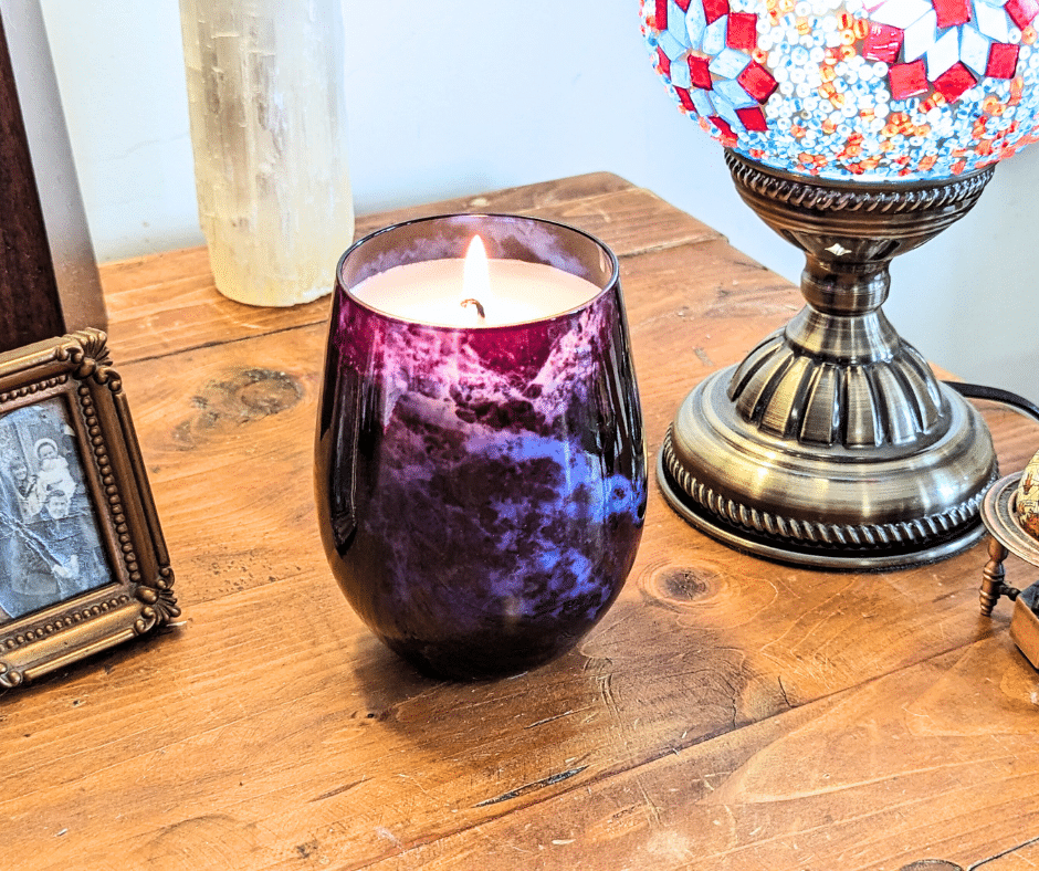 The Midnight Magic Candle features an exquisite blend of Bergamot and Patchouli fragrance oils.