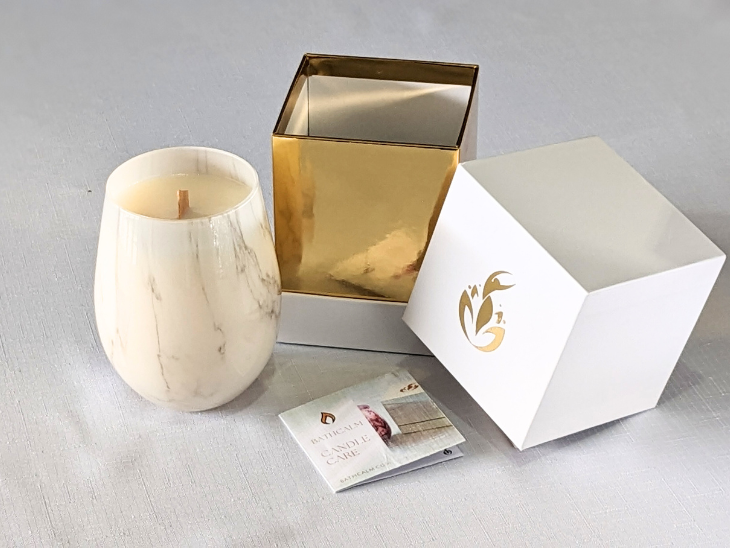 BathCalm's Ambrosian Romance Candle is set in a stylish white jar, with a marble-look finish. BathCalm’s wooden wick candle is made from environmentally friendly Ecococowax. Each candle has a burn time of 60+ hours and comes with its own luxury white and gold branded box.