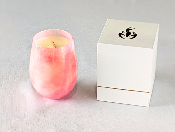 BathCalm's Blushed Beauty candle with wooden wick is delightfully warm and feminine. It features floral rose and geranium notes, and set in a pretty pink jar that's evocative of rose quartz. The Ecococo Wax burn time is 60 plus hours. The blushed Beauty Candle comes with a sturdy white and gold branded box, adding a touch of luxury.