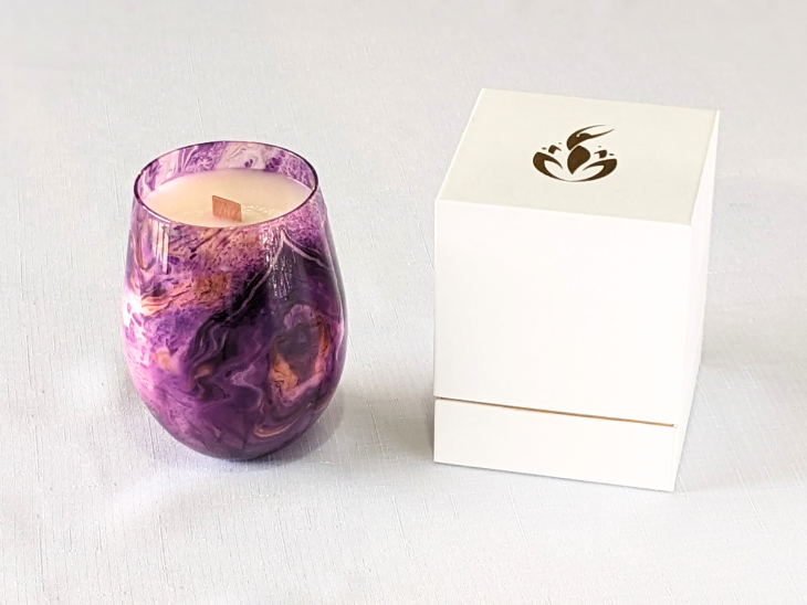 The Cosmic Bliss Candle comes with a sturdy white and gold branded box, adding a touch of luxury.
