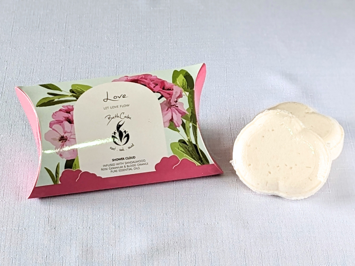 The "Love" two-pack Shower Clouds have a gorgeous blend of Sandalwood, Cedarwood, Rose Geranium and Blood Orange pure essential oils. Set in a pretty pink pillow box featuring rose geranium flowers, this packaging is fully home-compostable.