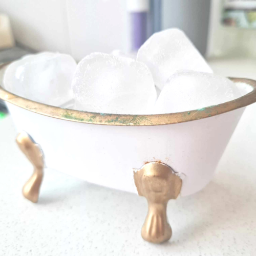 A miniature cold plunge bath with ice in it.