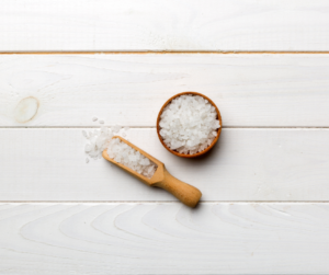 A bowl of Epsom salts with wooden spoon. Epsom salts are composed of magnesium and sulfate, and their chemical formula is MgSO₄·7H₂O. The magnesium in Epsom salts is believed to be absorbed through the skin during a bath, providing various health benefits such as muscle relaxation and stress relief. Actual absorption through the skin has not been scientifically proven, however and while its properties are well-documented, the claim that Epsom salts can kill bacteria is definitely not supported by scientific evidence.