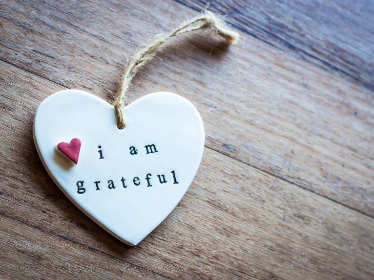 Gratitude is a Powerful Tool that Improves Our Lives. The image shows a love heart on a string with "I am grateful"